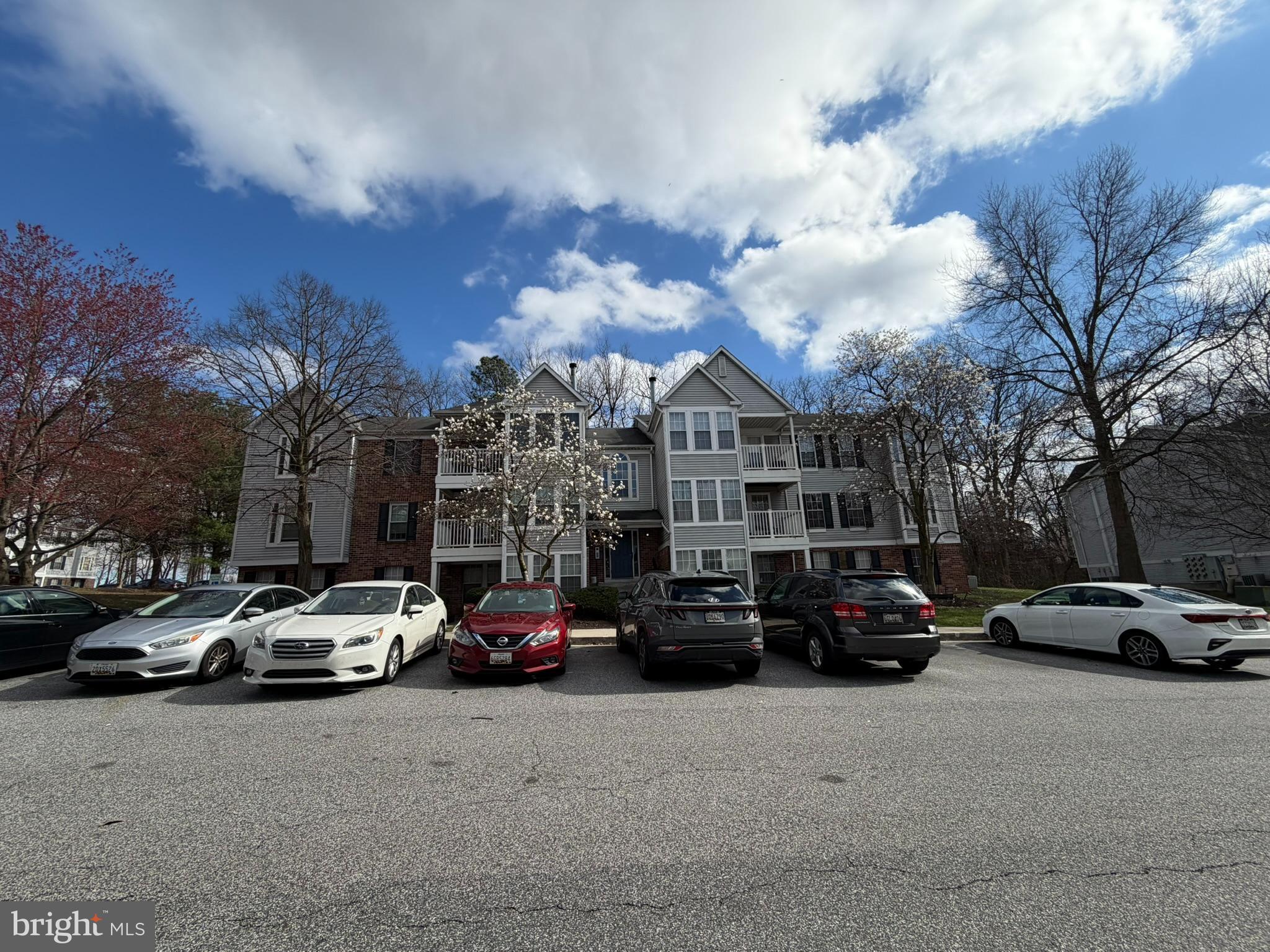 1305 Clover Valley Way, Unit 1305 Edgewood, MD 21040 - Photo 3 of 44 a view of cars parked in front of a building