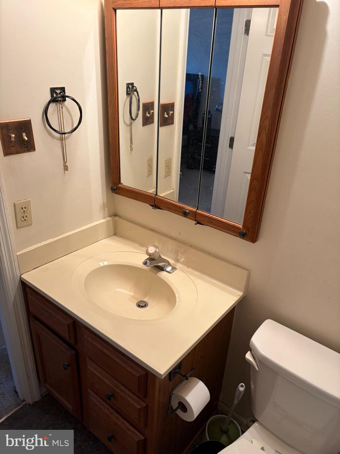 1305 Clover Valley Way, Unit 1305 Edgewood, MD 21040 - Photo 35 of 44 a bathroom with a sink toilet and mirror