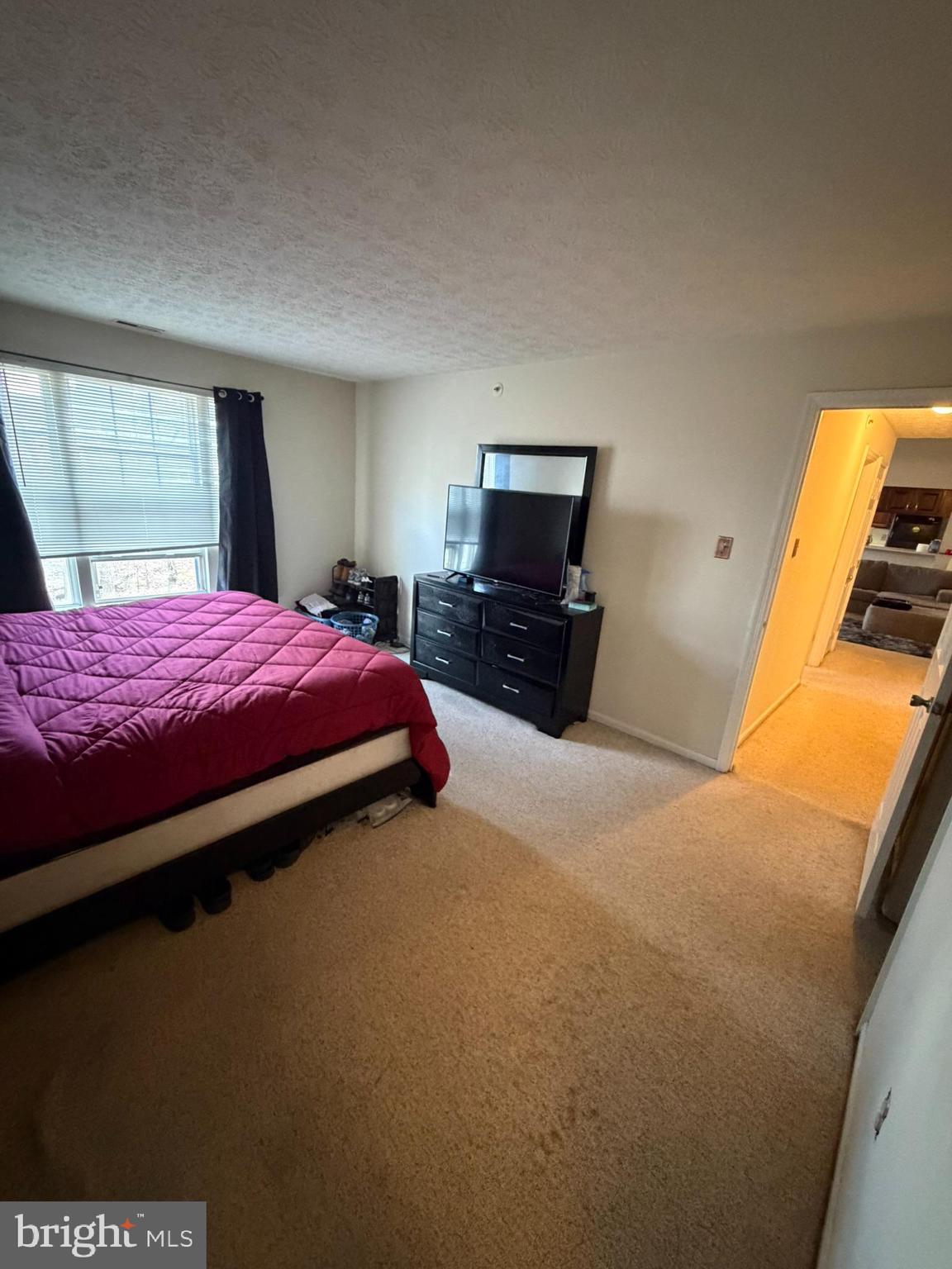 1305 Clover Valley Way, Unit 1305 Edgewood, MD 21040 - Photo 41 of 44 a bedroom with a bed and wooden floor