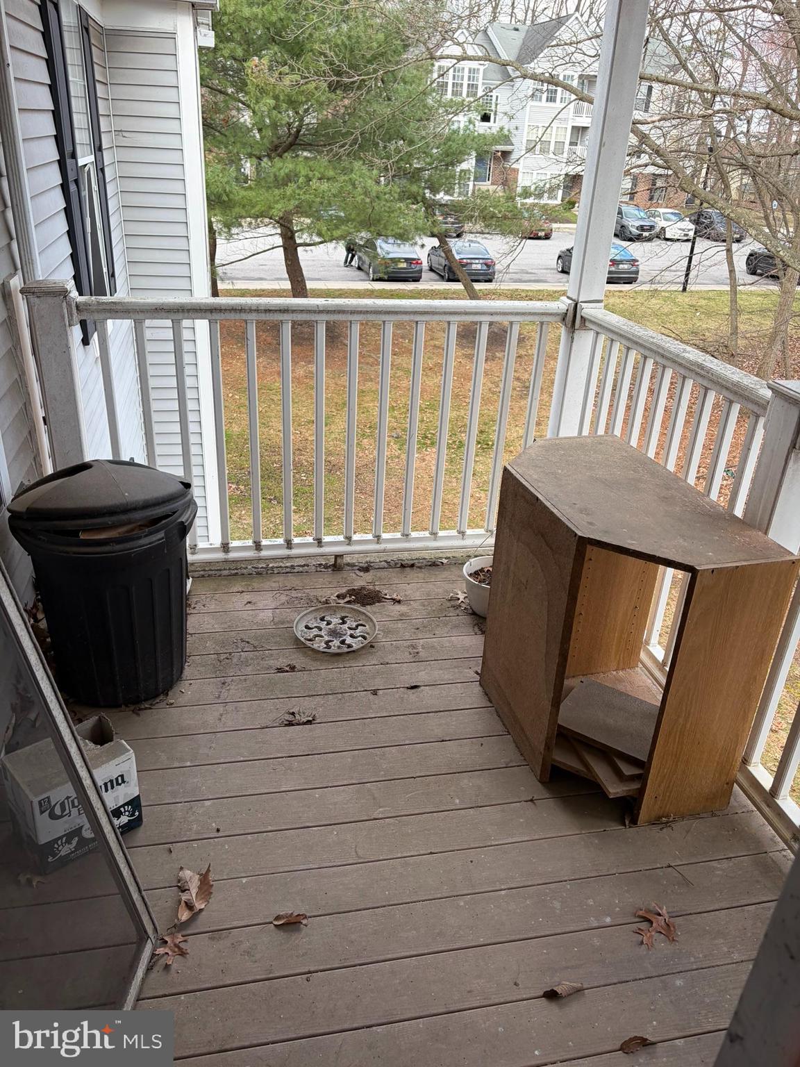 1305 Clover Valley Way, Unit 1305 Edgewood, MD 21040 - Photo 42 of 44 a view of a porch with wooden floor and iron stairs