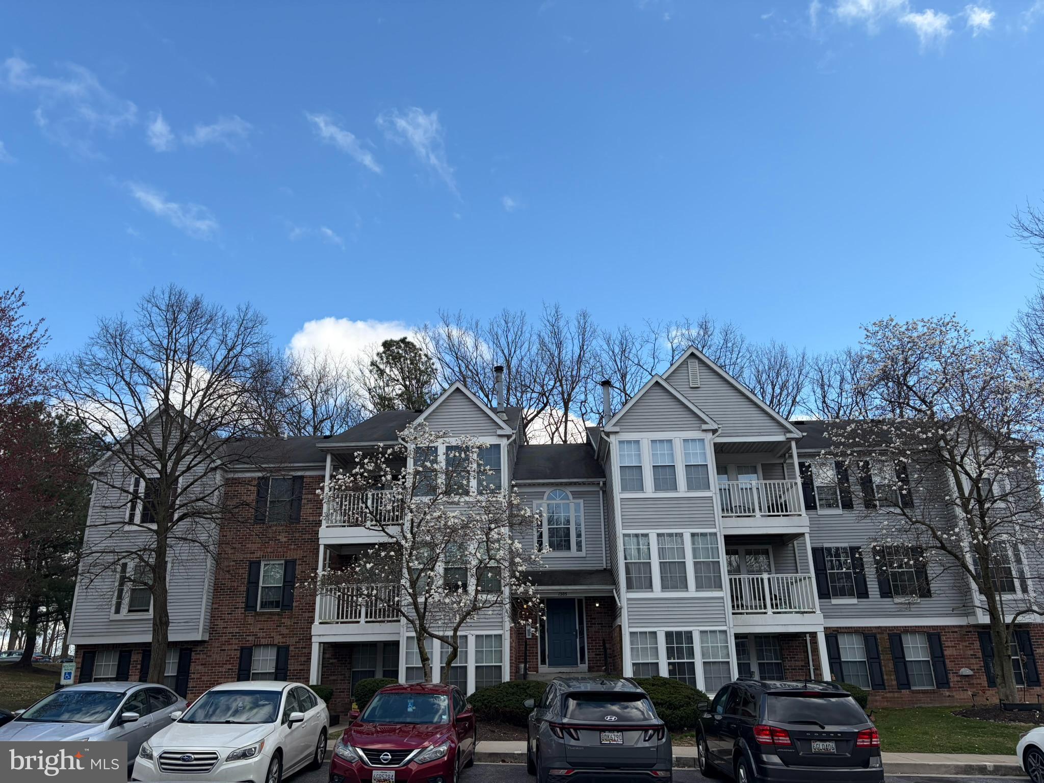 1305 Clover Valley Way, Unit 1305 Edgewood, MD 21040 - Photo 44 of 44 a front view of a building with lot of cars and trees