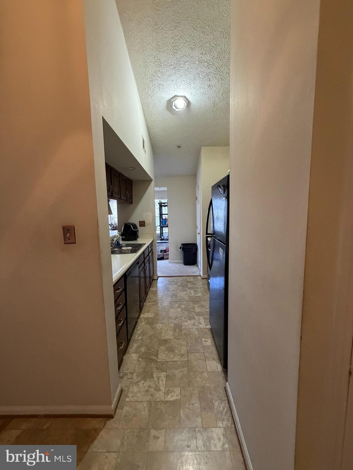 1305 Clover Valley Way, Unit 1305 Edgewood, MD 21040 - Photo 6 of 44 a kitchen with a refrigerator and a stove