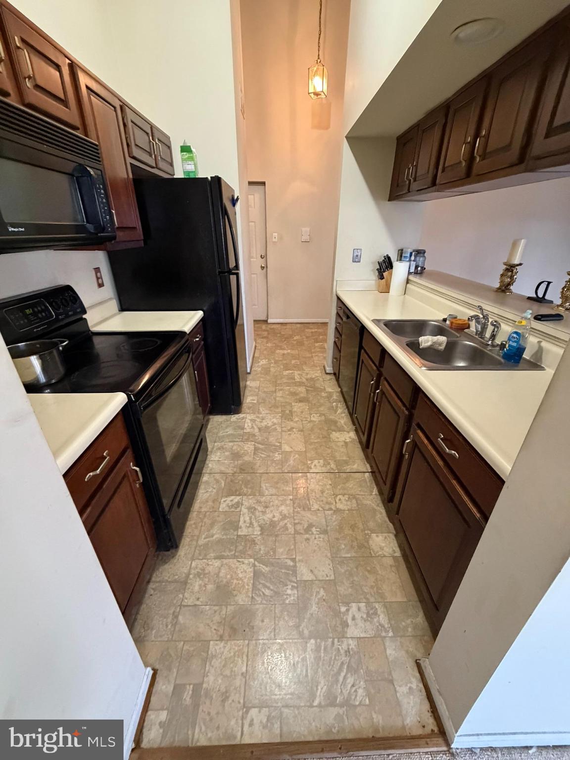 1305 Clover Valley Way, Unit 1305 Edgewood, MD 21040 - Photo 9 of 44 a kitchen with stainless steel appliances a sink stove and refrigerator