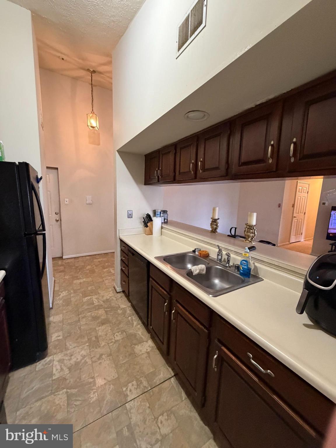 1305 Clover Valley Way, Unit 1305 Edgewood, MD 21040 - Photo 10 of 44 a kitchen with stainless steel appliances a sink stove and refrigerator