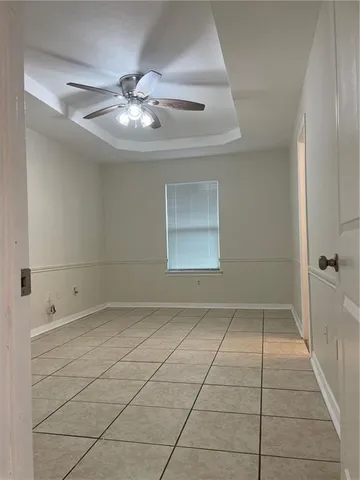 a bathroom with a toilet sink vanity tub and mirror
