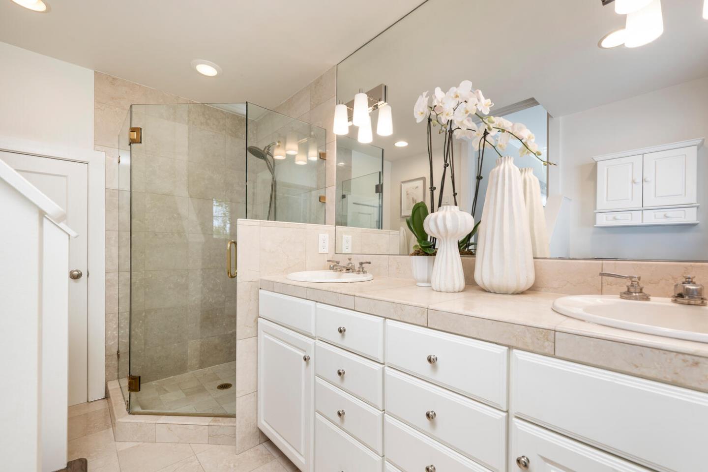841 Fairfield Road Burlingame, CA 94010 - Photo 17 of 25 a bathroom with a double vanity sink mirror and shower