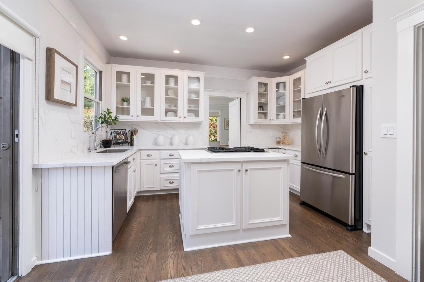 841 Fairfield Road Burlingame, CA 94010 - Photo 9 of 25 a kitchen with white cabinets and stainless steel appliances