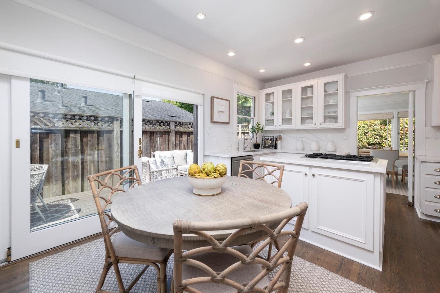 841 Fairfield Road Burlingame, CA 94010 - Photo 10 of 25 a kitchen with a table chairs and wooden floor