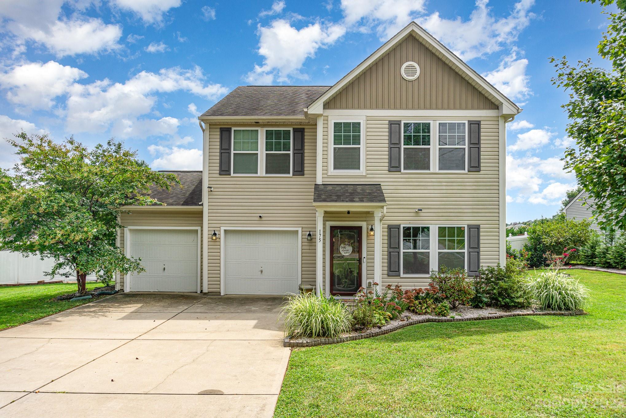 175 Old Carriage Road Clover, SC 29710 - Photo 1 of 34 a front view of a house with a yard