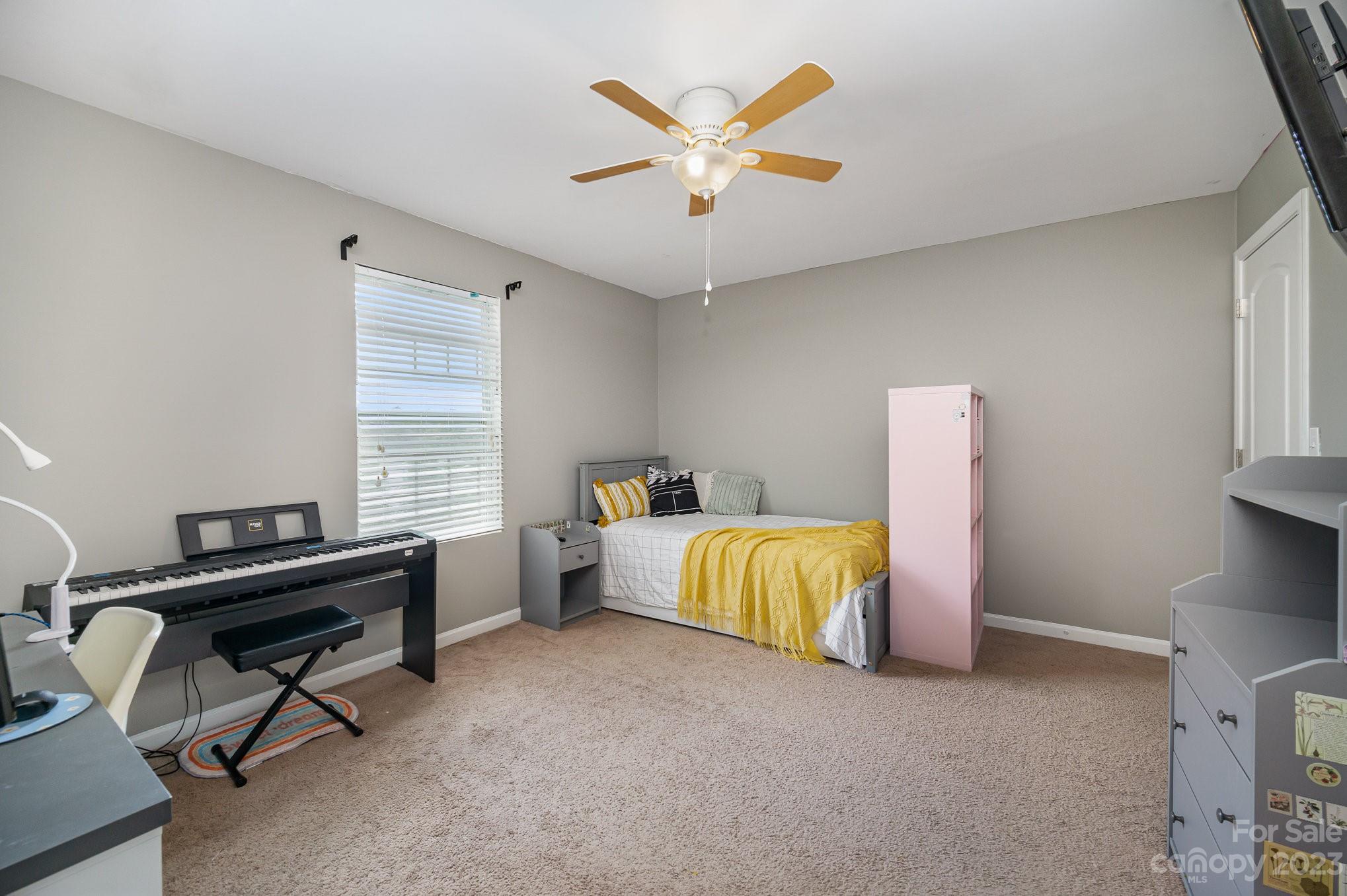 175 Old Carriage Road Clover, SC 29710 - Photo 26 of 34 a bed room with a bed and a window