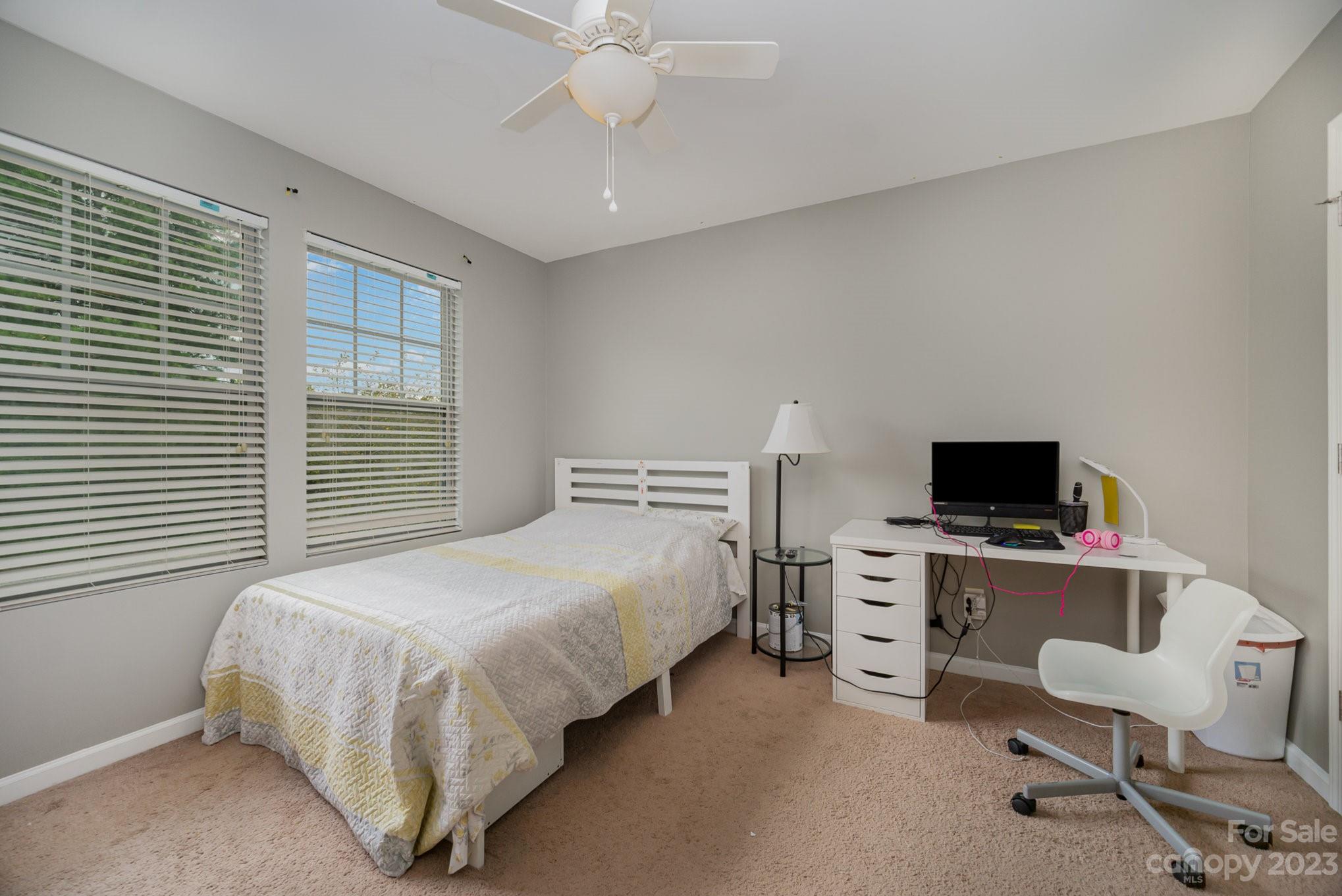 175 Old Carriage Road Clover, SC 29710 - Photo 27 of 34 a bedroom with a bed and a chair