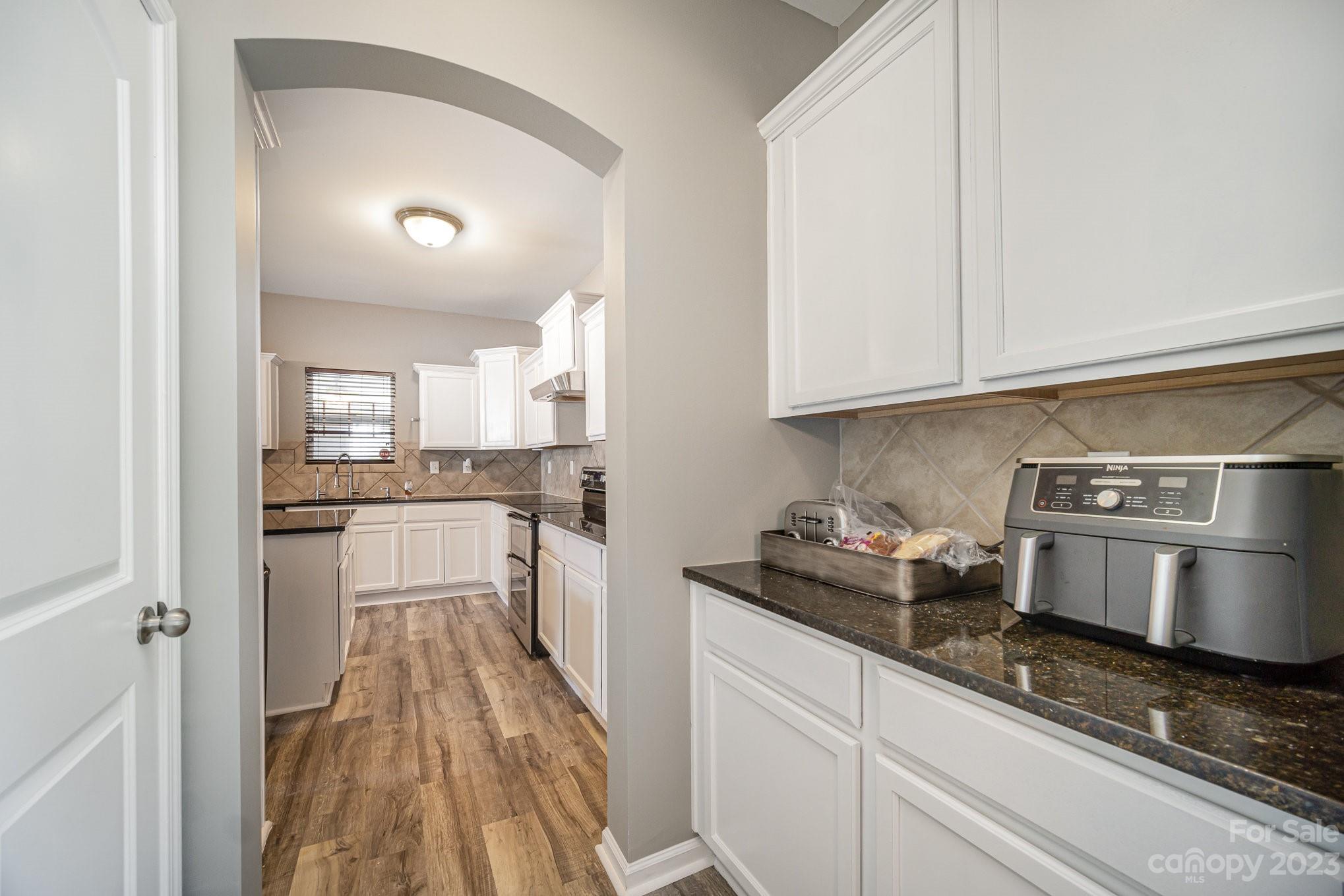 175 Old Carriage Road Clover, SC 29710 - Photo 9 of 34 a kitchen with stainless steel appliances granite countertop a sink and cabinets