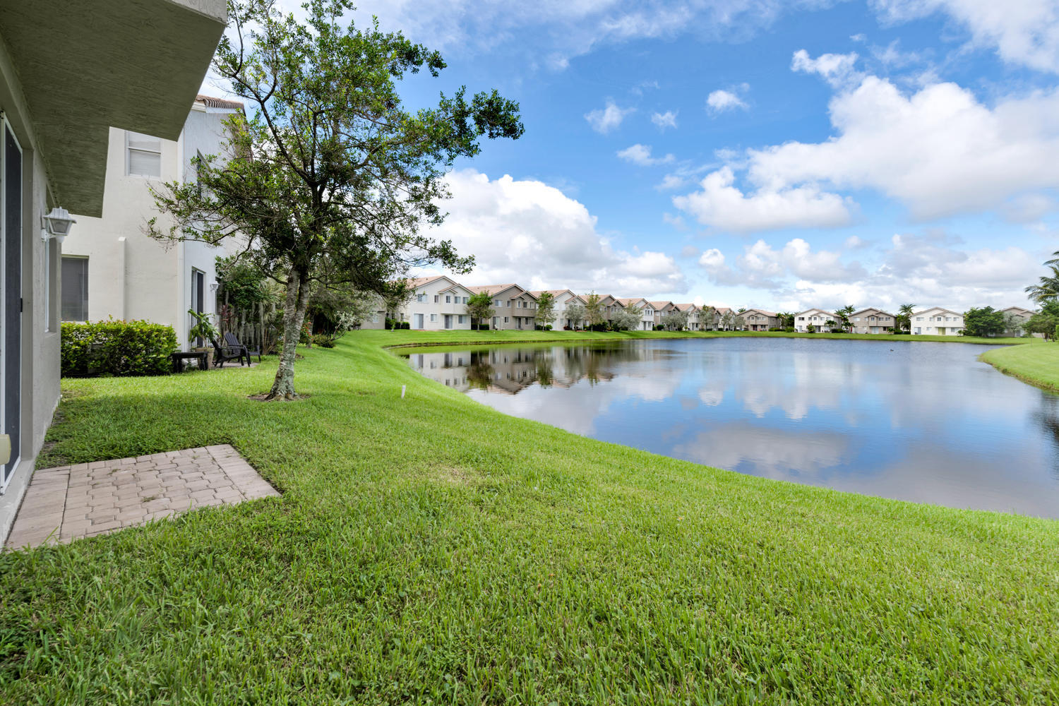 3222 Laurel Ridge Circle Riviera Beach, FL 33404 - Photo 5 of 30 OPEN GRASS AREA BY YOUR LAKE
