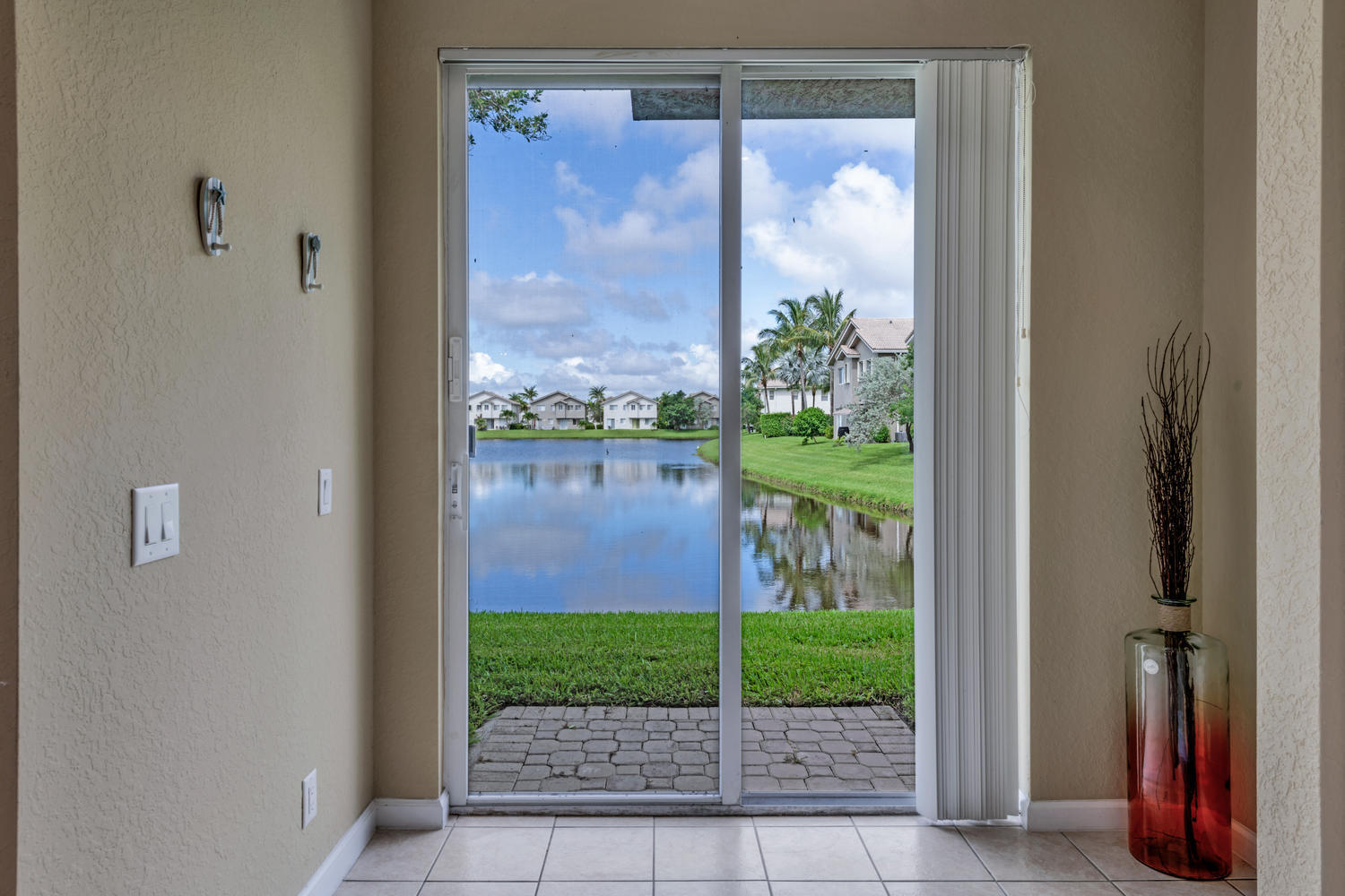 3222 Laurel Ridge Circle Riviera Beach, FL 33404 - Photo 10 of 30 PATIO/KITCHEN/LIVING/DINING VIEW