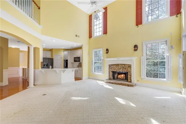 a bathroom with a toilet a sink and a mirror