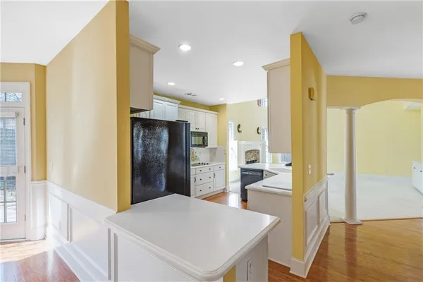 a bathroom with a sink a mirror and a shower