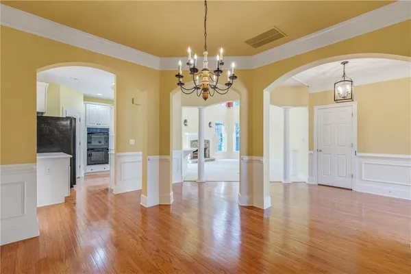 a view of a kitchen with wooden floor