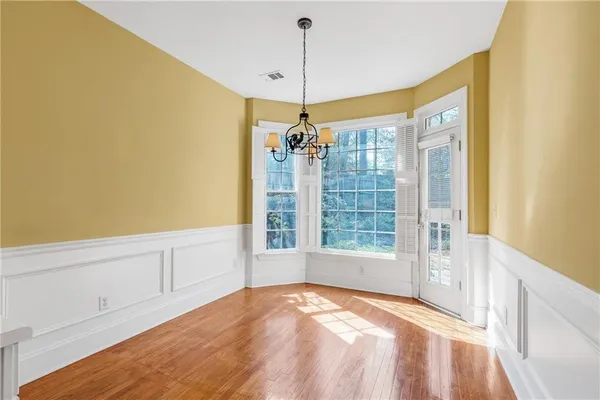 a view of a big room with windows and entryway