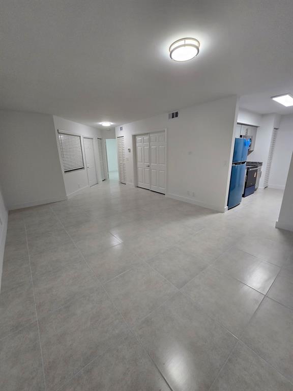 8657 Southwest 5th Street, Unit 201 Pembroke Pines, FL 33025 - Photo 12 of 15 a view of an empty room with a window