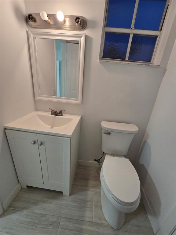 8657 Southwest 5th Street, Unit 201 Pembroke Pines, FL 33025 - Photo 13 of 15 a white toilet sitting next to a bathroom sink