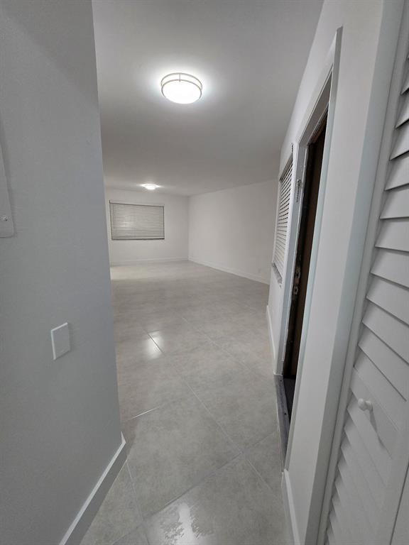 8657 Southwest 5th Street, Unit 201 Pembroke Pines, FL 33025 - Photo 10 of 15 a view of a hallway