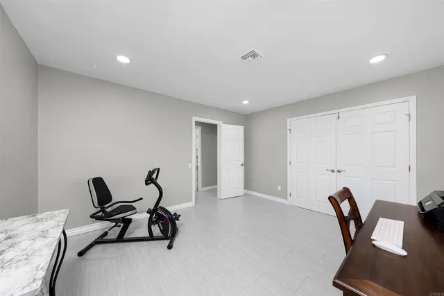 a workspace with a table and chairs