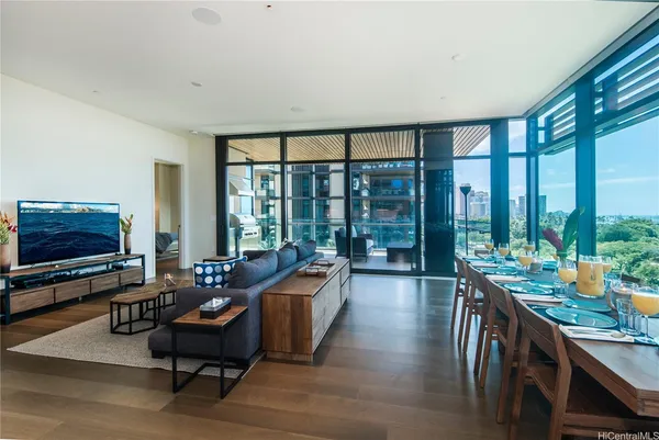 a dining room with furniture and wooden floor