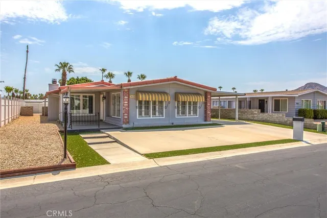 a view of pool with a chairs