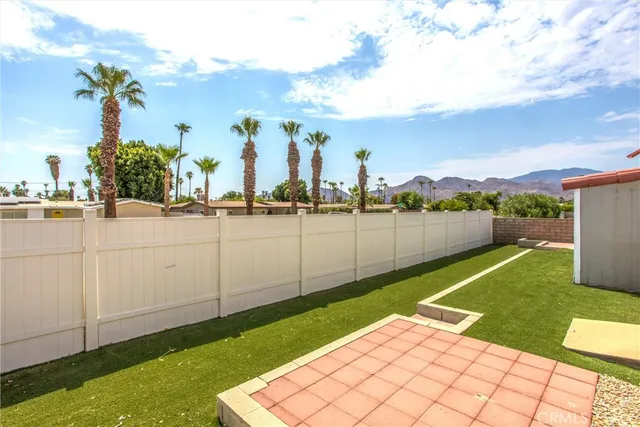 a view of swimming pool with outdoor seating