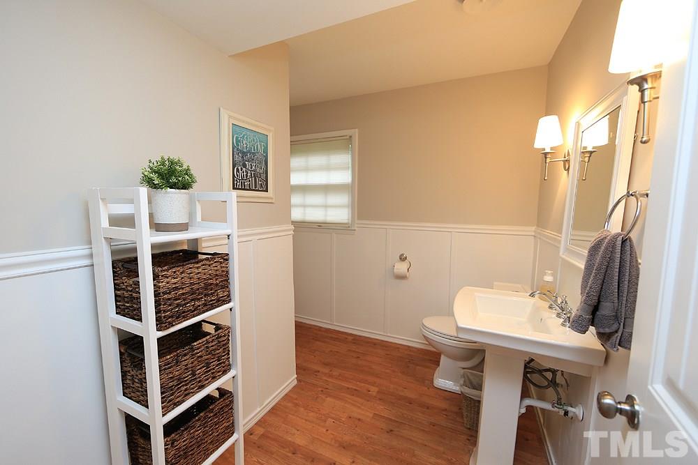 6004 Spring Valley Drive Raleigh, NC 27616 - Photo 11 of 25 This bath is off the family room. Around the corner is the washer and dryer. Next to this room is an additional room that makes a great home office or guest bedroom.