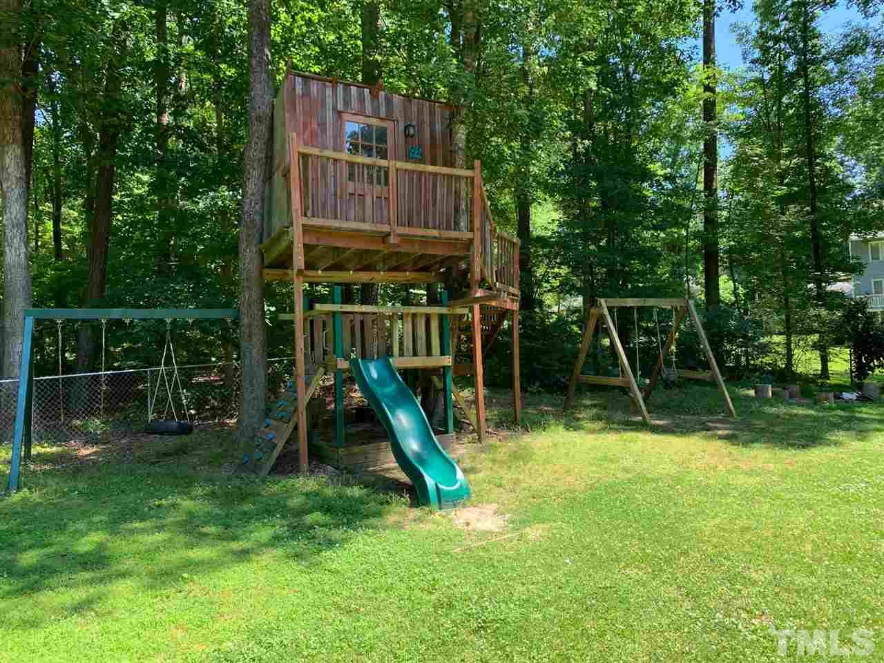 6004 Spring Valley Drive Raleigh, NC 27616 - Photo 19 of 25 The fort, the swings, the slide...it is kid heaven!