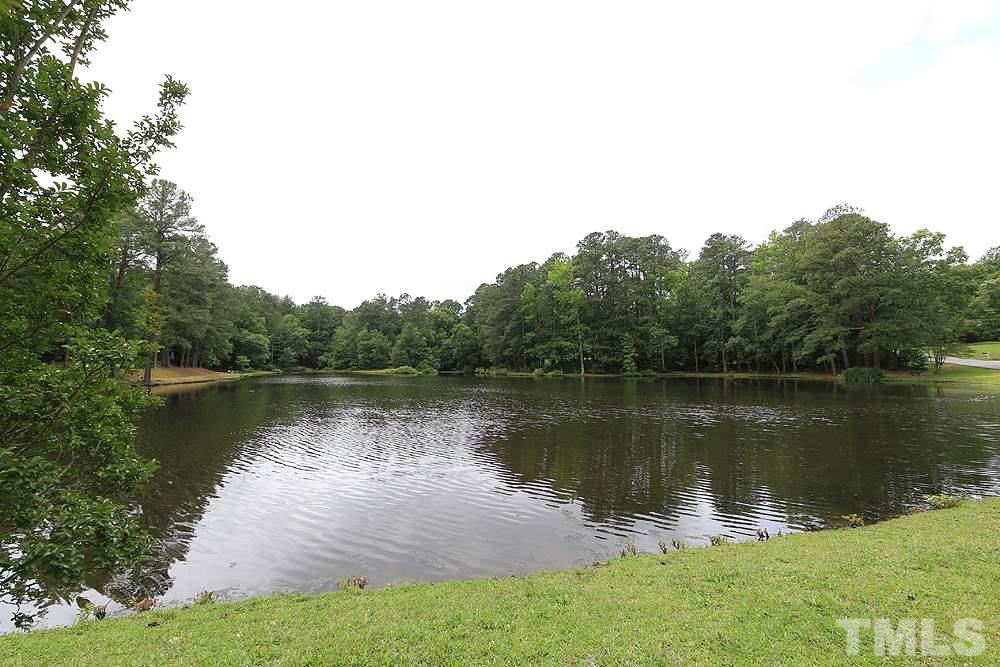 6004 Spring Valley Drive Raleigh, NC 27616 - Photo 21 of 25 Just a quick walk from the house, you will be at the pond.