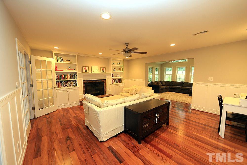 6004 Spring Valley Drive Raleigh, NC 27616 - Photo 9 of 25 What a lovely family room! Fireplace, bookshelves, hardwoods. To the left in the picture is a room that easily can be used for a home office or guest bedroom.