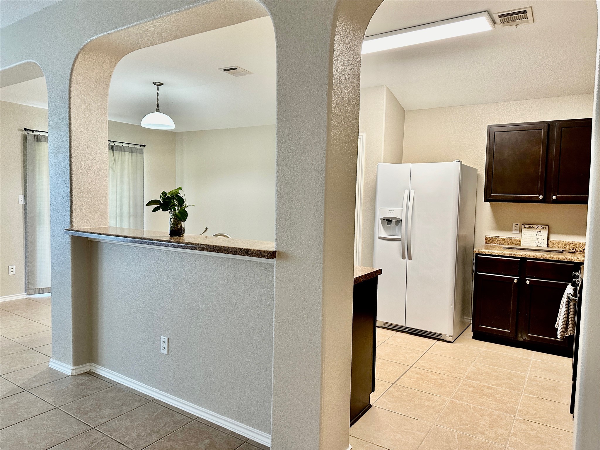 207 Dragon Ridge Road Buda, TX 78610 - Photo 9 of 38 Another angle of the kitchen from the living room