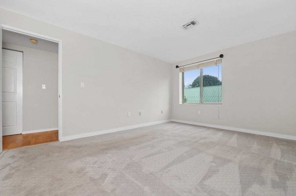 183 Oak Street, Unit 307 Newton, MA 02464 - Photo 12 of 24 a view of an empty room with a window