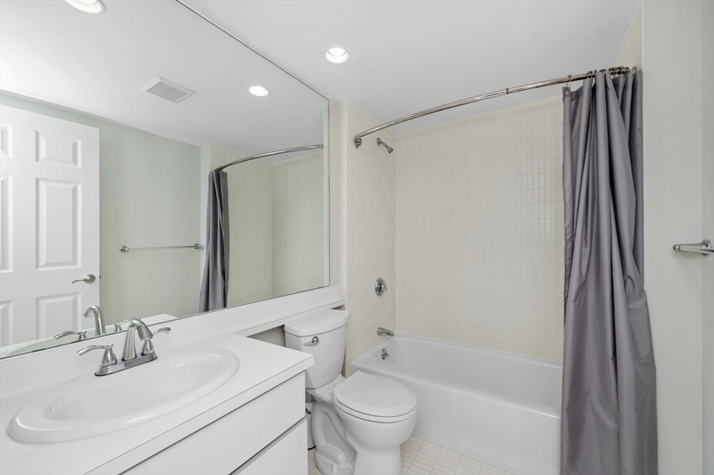 183 Oak Street, Unit 307 Newton, MA 02464 - Photo 15 of 24 a bathroom with a sink toilet and shower