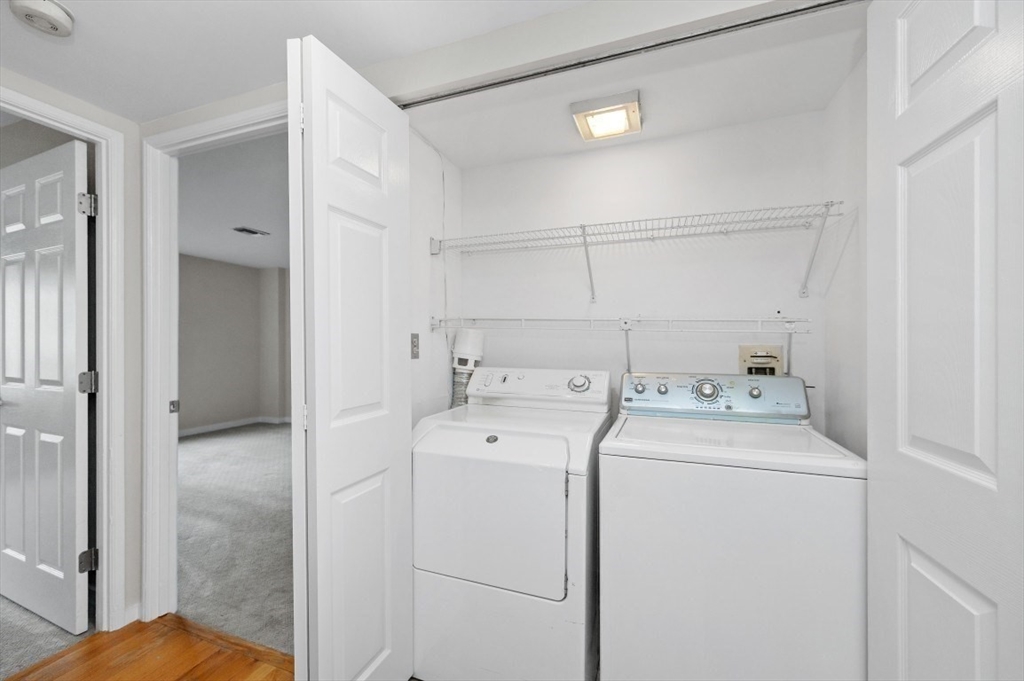183 Oak Street, Unit 307 Newton, MA 02464 - Photo 16 of 24 a view of storage and utility room with washer and dryer