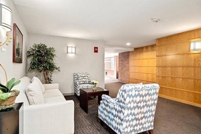 183 Oak Street, Unit 307 Newton, MA 02464 - Photo 17 of 24 a living room with furniture and a potted plant