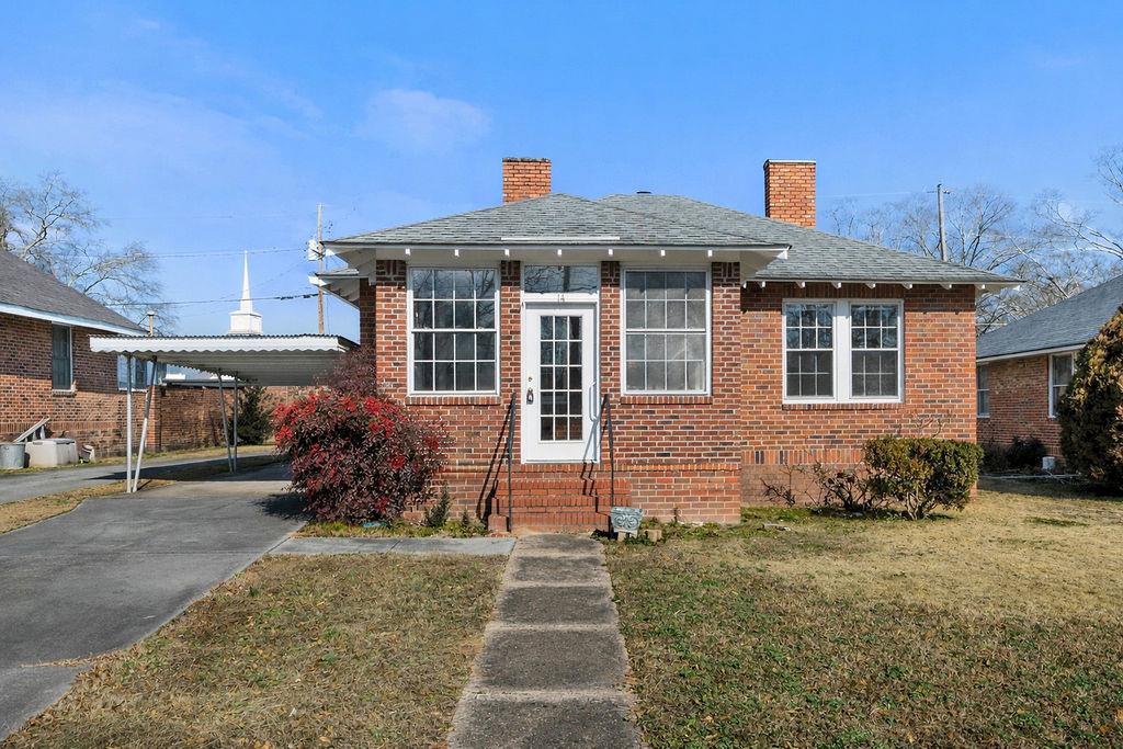 14 Green Street Northeast Rome, GA 30161 - Photo 1 of 24 a front view of a house with garden