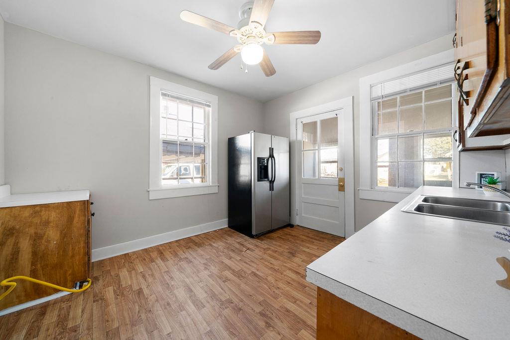 14 Green Street Northeast Rome, GA 30161 - Photo 11 of 24 a kitchen with stainless steel appliances granite countertop a refrigerator a sink a stove and island