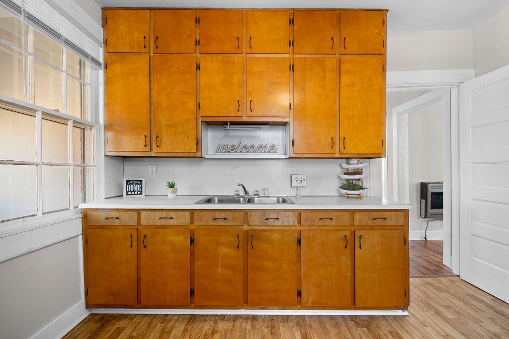 14 Green Street Northeast Rome, GA 30161 - Photo 12 of 24 a kitchen with stainless steel appliances granite countertop a sink window and cabinets