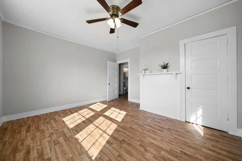 14 Green Street Northeast Rome, GA 30161 - Photo 18 of 24 a view of empty room with wooden floor and ceiling fan