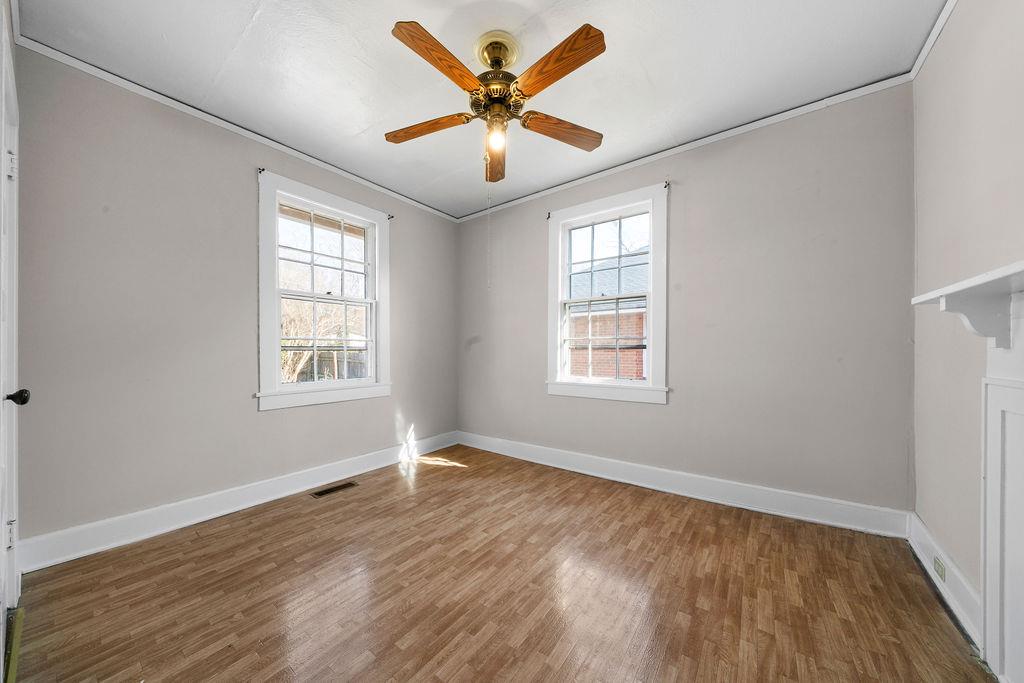 14 Green Street Northeast Rome, GA 30161 - Photo 20 of 24 an empty room with wooden floor and windows