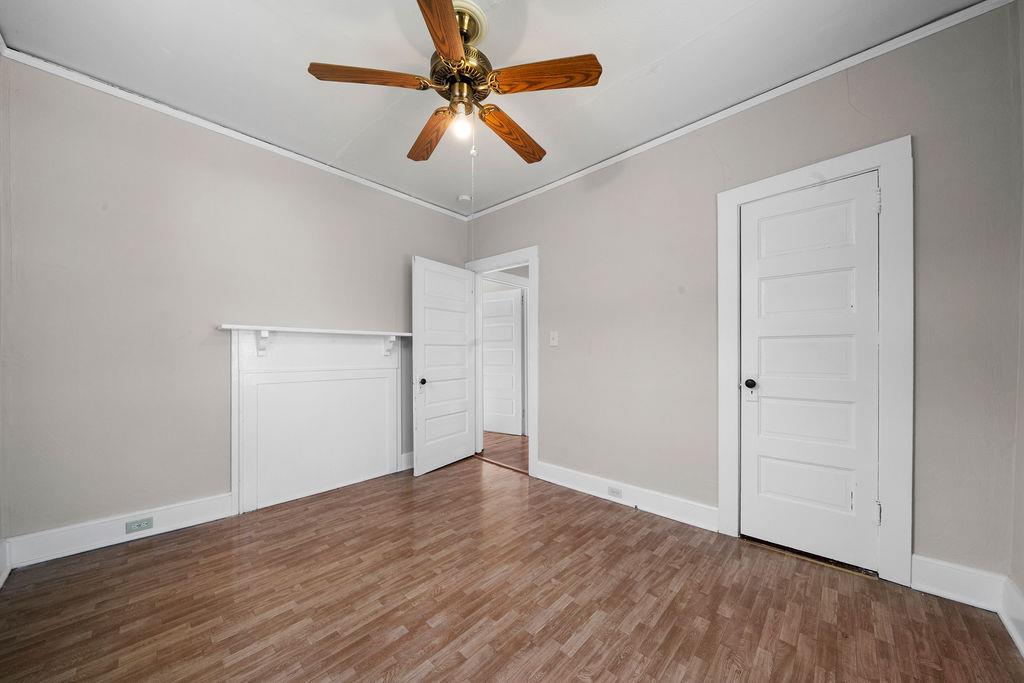 14 Green Street Northeast Rome, GA 30161 - Photo 21 of 24 an empty room with wooden floor fan and windows