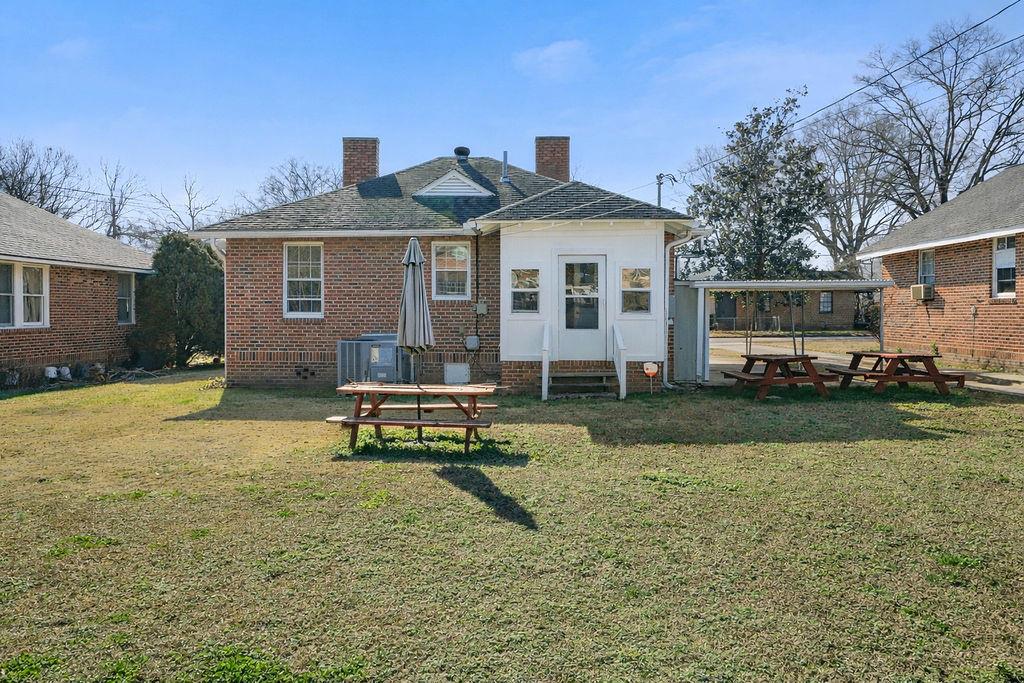 14 Green Street Northeast Rome, GA 30161 - Photo 22 of 24 a view of a house with backyard and sitting area
