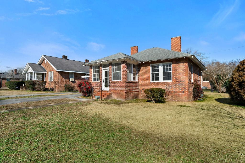 14 Green Street Northeast Rome, GA 30161 - Photo 4 of 24 a view of a house with a yard