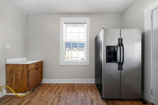 a kitchen with stainless steel appliances granite countertop a refrigerator a sink a stove and island