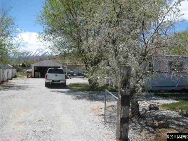 15585 Toll Road Reno, NV 89521 - Photo 1 of 1 a view of a car parked in front of a house