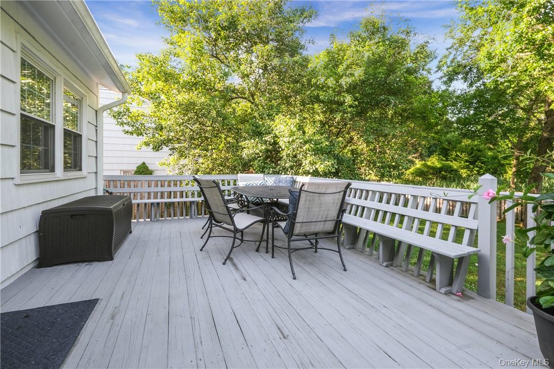 393 Milton Road Rye, NY 10580 - Photo 14 of 22 Spacious deck overlooking backyard located directly off the kitchen overlooking the tree tops. Easy grilling. Stairs that access the back yard.