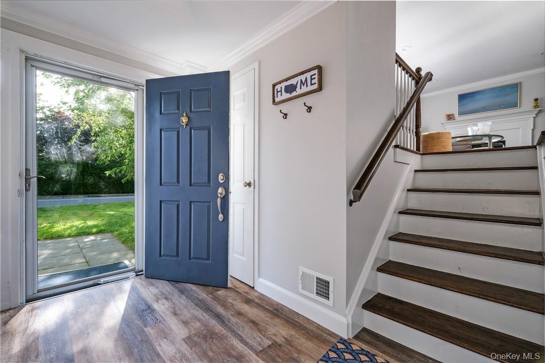 393 Milton Road Rye, NY 10580 - Photo 2 of 22 Gracious entry foyer with custom built-in front hall closet. French doors leading to family room (or additional BR), full bath. Additional door leading to one car garage with additional storage.